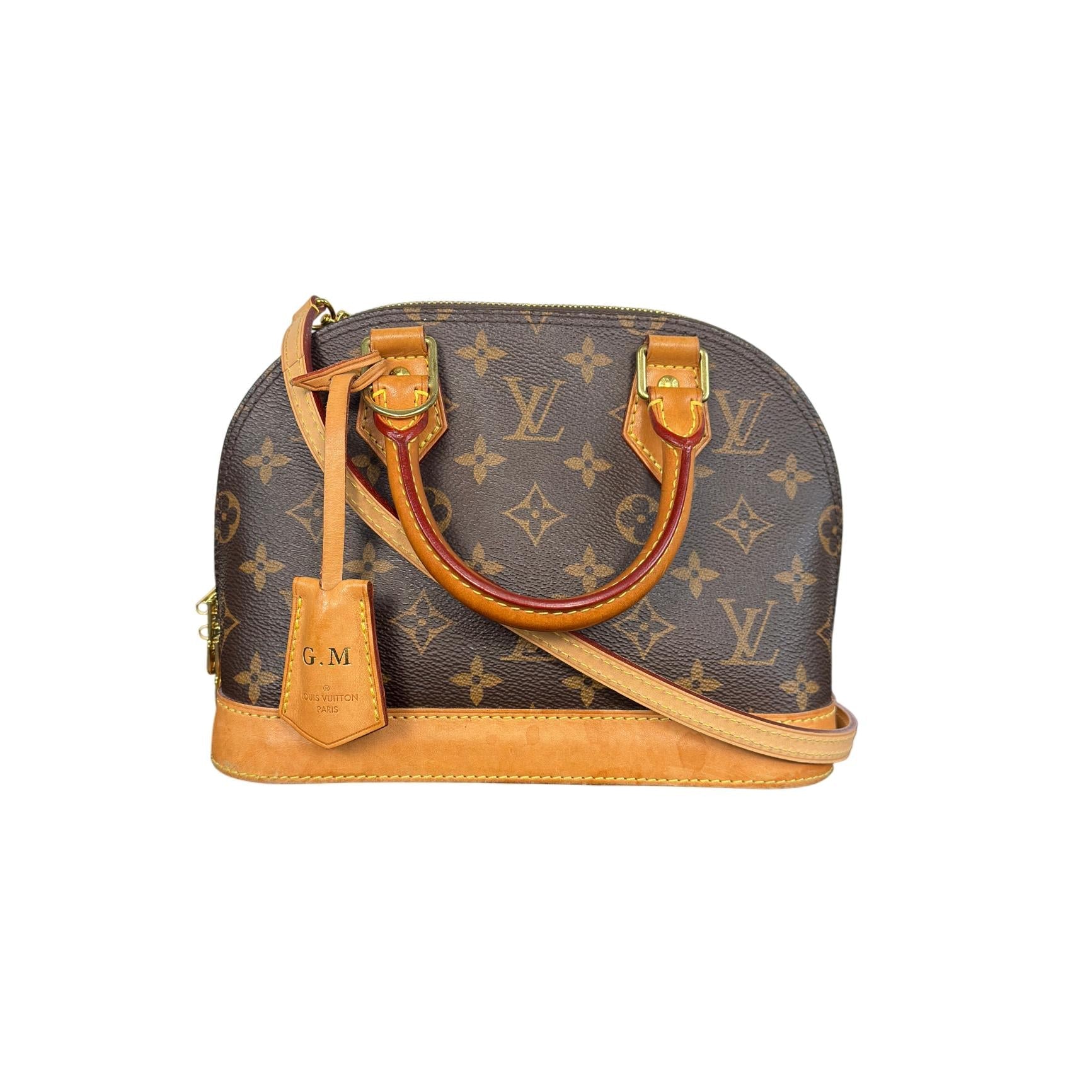 Designer handbag with monogram pattern on a white background
