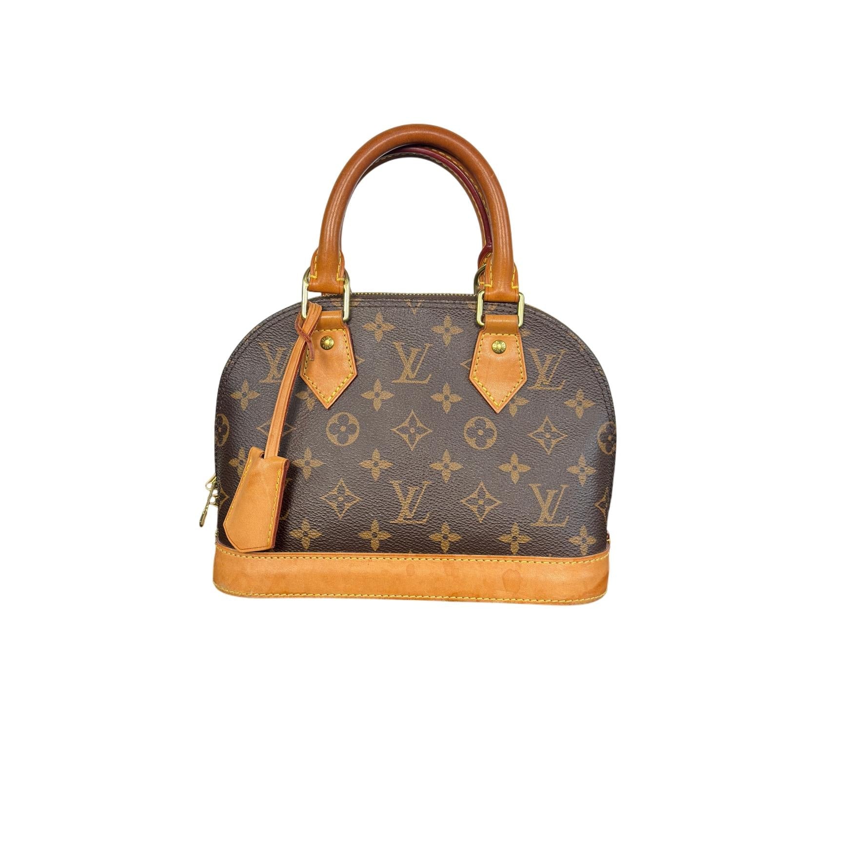 Designer handbag with monogram pattern on a white background